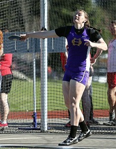 Julie Jansen flings the discus in Thursday's meet. Jansen won the event and helped the Wildcat girls win the double dual meet.