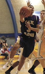 Drew Washington takes it to the hoop around Ferndale's Aiden Sands.