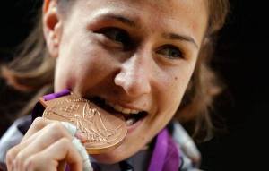 Oak Harbor’s Marti Malloy celebrates her bronze-medal performance in judo at the Olympics in London.