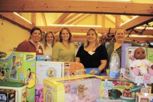 Volunteers are distributing gifts gathered by the Toys for Tots Toy Drive. Pictured from the left are Mary Engle