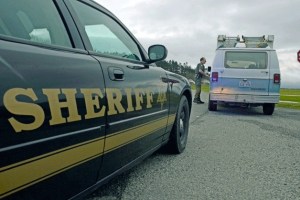 Deputy Chris Garden with the Island County Sheriff’s Office gives a motorist a speed warning at Camp Casey on Central Whidbey. Sheriff Mark Brown is juggling critical staffing levels and is again seeking support for a law-and-justice tax.
