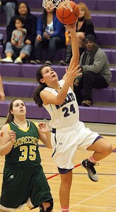 Oak Harbor's AnnaBelle Whitefoot beats Shorecrest's Josie Dorn to the hoop in Friday's game.