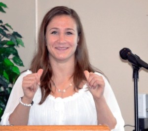 Olympic bronze medalist Marti Malloy motions towards herself while making a joke as she answered a question from the audience at the Oak Harbor Council of the Navy League meeting Tuesday at the Officers’ Club on Naval Air Station Whidbey Island.