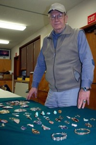 Dick James displays a number of the jewelry