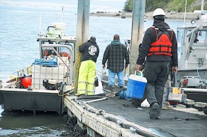 Divers from Ballard Diving & Salvage prepare to head out to the sunken Deep Sea Thursday after the day’s shift change. Twenty-four-hour operations ceased this week and the Penn Cove Water Festival will go ahead as planned.