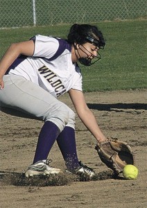 Oak Harbor second baseman Kat Martinez scoops up a low throw Wednesday.