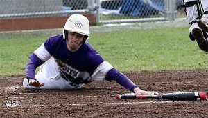 Sean Erskine scores on Brent Mertins' double in Oak Harbor's win Friday.