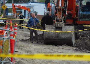 Lt. Tim Sterkel and Detective Ron Hofkamp of the Oak Harbor Police Department stand near human remains discovered on SE Pioneer Way. They are believed to be of Native American origin.