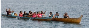 Women in the six-person canoe race compete neck and neck toward the Coupeville Wharf during a race Saturday at the  19th annual Penn Cove Water Festival.