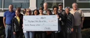 Organizers of the Oak Harbor Pigfest and recipients of the $12