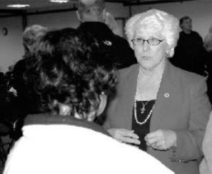 State Sen. Mary Margaret Haugen talks with a constituent before the town hall meeting Wednesday.