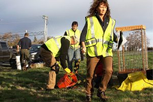 Laura Renninger, president of the Oak Harbor Garry Oak Society, prepares for the planting of 30 new Garry oak trees on Navy property in Oak Harbor Friday.