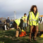 Laura Renninger, president of the Oak Harbor Garry Oak Society, prepares for the planting of 30 new Garry oak trees on Navy property in Oak Harbor Friday.