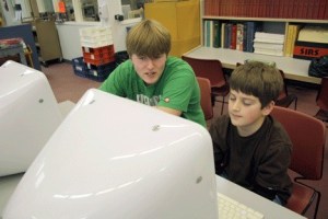 Coupeville High School Senior Zack Piercy works with sixth-grader Mitchell Losey during a Big Brothers Big Sisters meeting after school in the high school library.