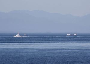 A U.S. Coast Guard vessel passes Saturday