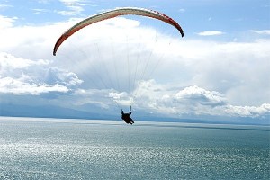 A paraglider soars above Fort Ebey State Park. A proposal is being considered by the Washington State Parks and Recreation Commission that would allow such activity to take place on the bluff trail at Ebey’s Landing.