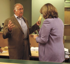 Basil Badley speaks with his attorney