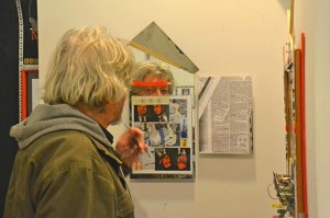 Richard Evans contemplates an art installation called “Poor Little Rich Boy.” Evans includes mirrors in his work to “get people involved in the art — just for a moment