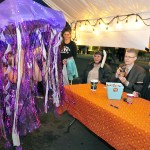 Nisa Hagan, left, shows off her jellyfish costume to judges Lance Gibbon, Oak Harbor Public School superintendent and Sandra Mulkey, director at Regency on Whidbey Monday on Pioneer Way in Oak Harbor. Photo by Michael Watkins/Whidbey News-Times