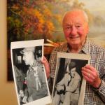 Michael Russo proudly hold two of his photographs he took over his career. On the left is a photo of General Matthew Ridgway and right, a photo of comedian Bob Hope. Photo by Michael Watkins/Whidbey News-Times