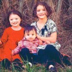 Ethan Edwards, center, is surrounded by his sisters Mia, left, and Alexis, in a photo taken in October. Photo provided