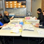 From left to right, Dodie Hanby, Sue Nelson, Casie Horr and Toni Craggs process ballots in Coupeville Monday. Photo by Michael Watkins/Whidbey News-Times
