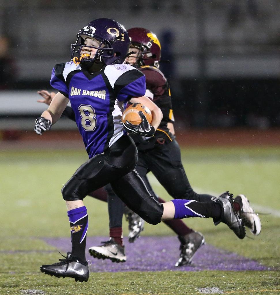 Tristin runs for one of his two TDs Saturday. (Photo by John Fisken)