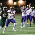 Oak Harbor&rsquo;s Kamren Mebane (59) signals touchdown as TJ Hollins-Passmore sprints away from Timberline&rsquo;s Tyrin Edmond (25) on the way to a 32-yard score Friday. (Photo by John Fisken)