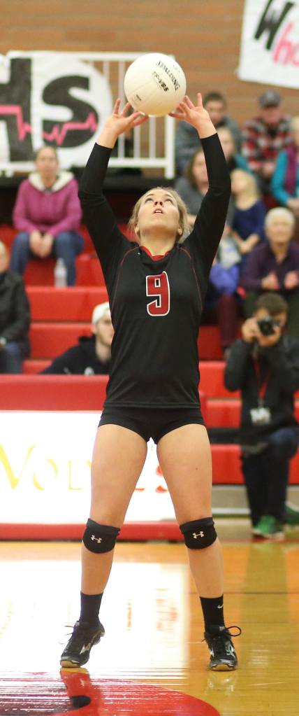 Lauren Rose gets the offense started with a set. (Photo by John Fisken)