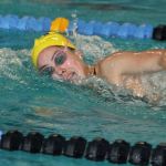 Olivia Tungate, shown here in a meet earlier this fall, was involved in two record-breaking performances at the district swim meet Saturday. (Photo by Jim Waller)