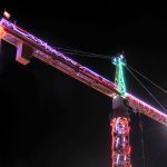 Photo by Michael Watkins / Whidbey News-Times                                The 165-foot crane that towers above the sewage treatment plant at Oak Harbor&rsquo;s waterfront is lit up with Christmas lights this week. Workers strung 3,900 feet of LED lights to decorate the crane, which was brought in to help with the sewage treatment plant being built in Windjammer Park. The city and Hoffman Construction shared in the cost of the lights. The original intention was to switch on the lights after Thanksgiving but someone was over-eager and turned them on ahead of time, according to city officials.