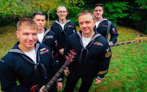 Navy Band Northwest&rsquo;s popular music band Passage performs popular music and encourages audience interaction. Their repertoire includes hits by Red Hot Chilli Peppers, AC/DC, Bonnie Raitt, Bruno Mars, Journey, Stevie Wonder and Brian Setzer. United States Navy photo
