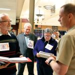 File photo                                Michael Monson, who was then president of Citizens of Ebey&rsquo;s Reserve, speaks with Capt. Michael Nortier, then-commanding officer of Naval Air Station Whidbey Island, during a 2013 scoping meeting on the Growler Environmental Impact Statement.