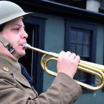 Ethan Lane, a music teacher from Marysville, plays a bugle to sound the call to assembly at Fort Casey State Park Saturday for the 9th Coast Artillery District, a living history group that focuses on bringing together pieces of actual history into a collection for the public to experience at various forts and historical locations throughout the Northwest. Photo by Michael B. Watkins/ Whidbey News-Times.