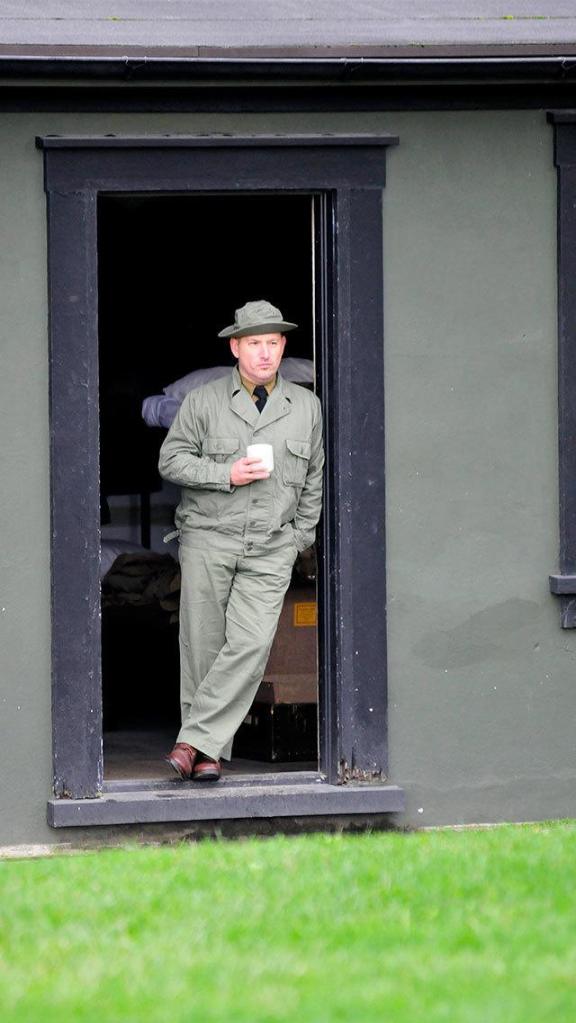 John McPherson enjoys an early morning cup of coffee prior to a day of giving living history tours at Fort Casey.