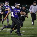 Malachi Rainey takes off on a long run for the Oak Harbor Senior team in its championhip win Saturday. (Photo by John Fisken)