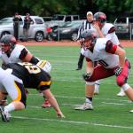 Tyler Adamson, front right, prepares to prodect quarterback Ian Kolste. (Photo courtesy of Whitworth Athletics)