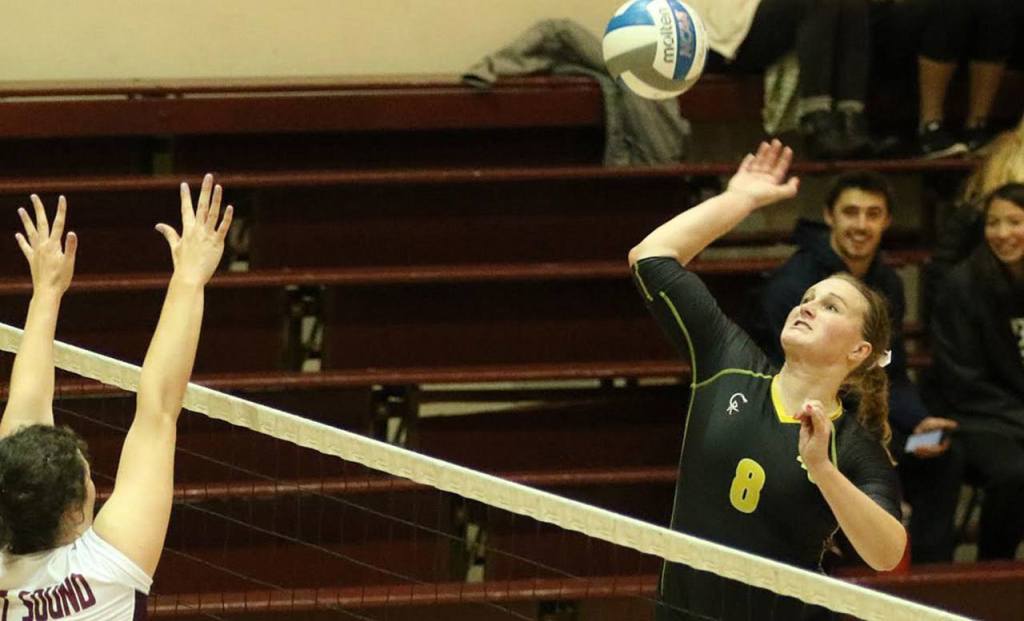 Roshel Donwen goes for the kill in a Pacific Lutheran volleyball match. (Photo courtesy of PLU Athletics)