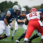 Dayne Herron (66) fires off the ball for New Hampshire. (Photo courtesy of UNH Athletics)