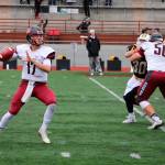 Ian Kolste sets up to pass for Whitworth as high school teammate Tyler Adamson (50) blocks. (Photo courtesy of Whitworth Athletics)