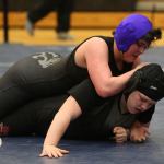 Meredith Bain, top, placed seventh in the state wrestling tournament last year. (Photo by John Fisken)