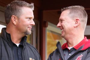 Brothers Jay and Jon Roberts of Coupeville own a custom home building design business together but don&rsquo;t share the same allegiance when it comes to the Apple Cup. Jay is a longtime Huskies season-ticket holder while Jon is a Cougars alum and diehard fan. Photo by Ron Newberry/Whidbey News-Times