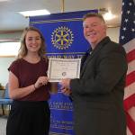 May receiving a student of the month certificate from Rotary Club president Greg Smith. Photo provided