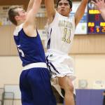 Ty Baker shoots around a Sedro-Woolley defender Friday. (Photo by John Fisken)