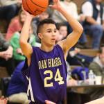 Haven Brown looks for an open teammate in Wednesday&rsquo;s win. Brown&rsquo;s strong defense helped Oak Harbor top South Whidbey. (Photo by John Fisken)