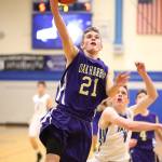 Adam Nelson slices to the hoop for a Wildcat basket at South Whidbey. (Photo by John Fisken)