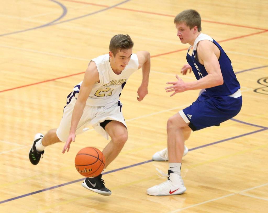 Adam Nelson tries to beat a Sedro-Woolley defender off the dribble. (Photo by John Fisken)