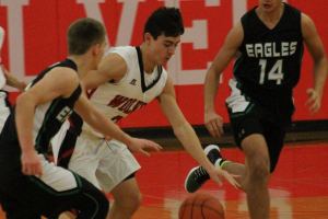 Wolves snare first win, avenge earlier loss / Boys basketball