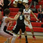Coupeville&rsquo;s Hunter Smith passes to Hunter Downes at the block in the win over Klahowya. (Photo by Jim Waller)