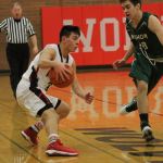 Hunter Smith uses a crossover dribble to try to get by Vashon Island&rsquo;s Jacob Chavez. (Photo by Jim Waller)